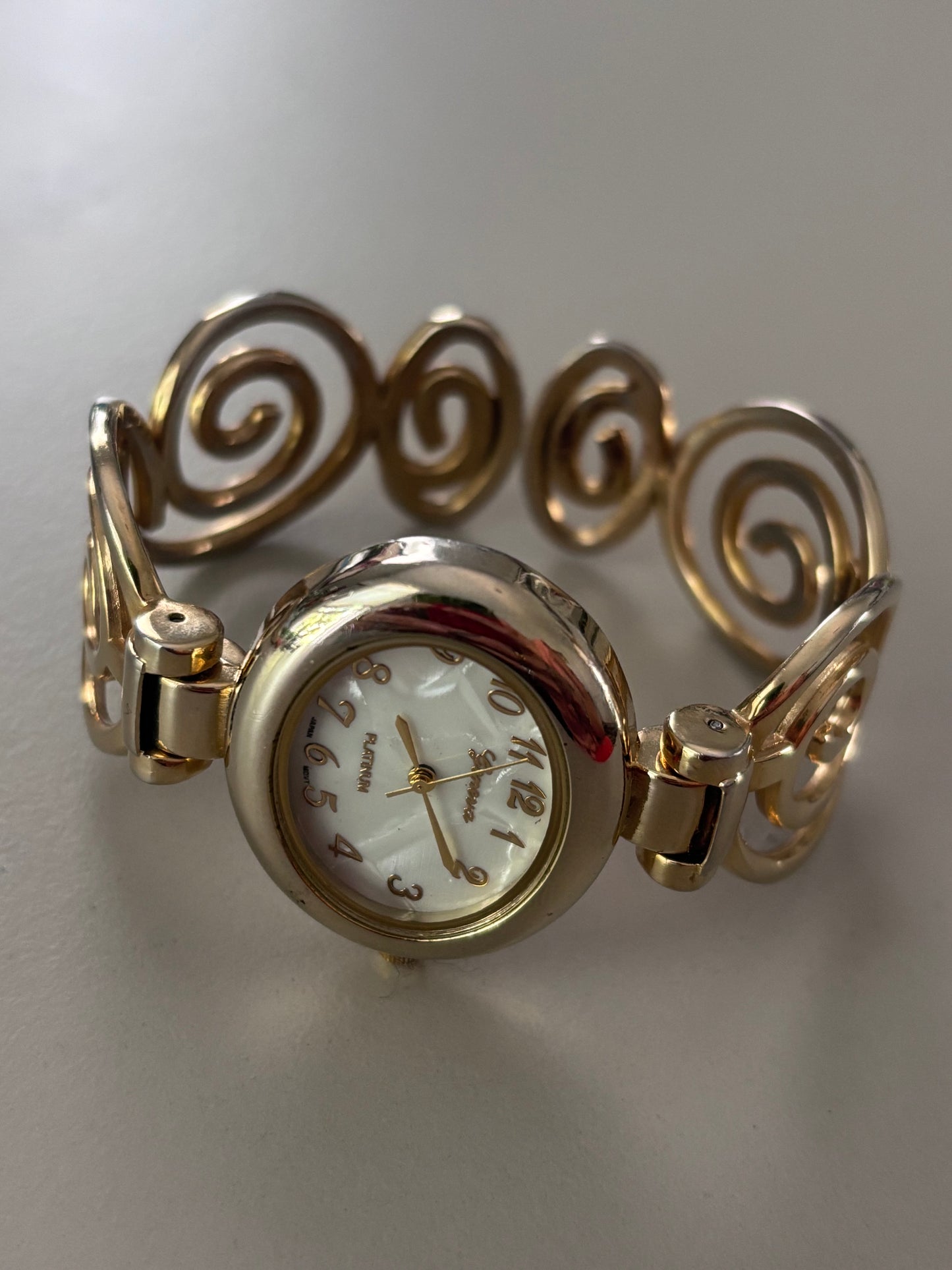 Gold Spiral Watch